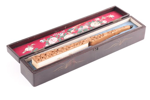 Lot 297 - A Chinese carved sandalwood and silk...