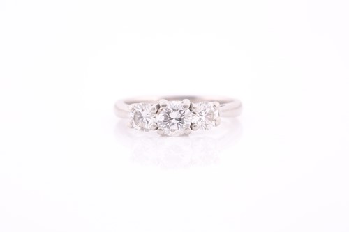 Lot 327 - A platinum and diamond ring, set with three...
