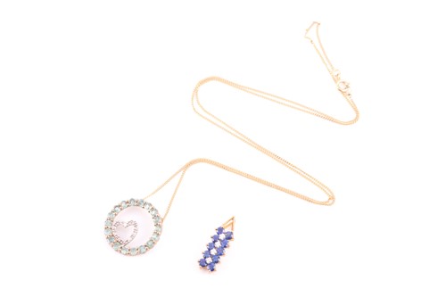 Lot 139 - A 9ct yellow gold and sapphire pendant, set...