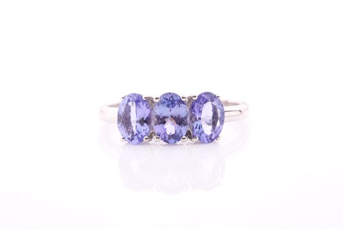 Lot 306 - A 9ct yellow gold and tanzanite ring, set with...