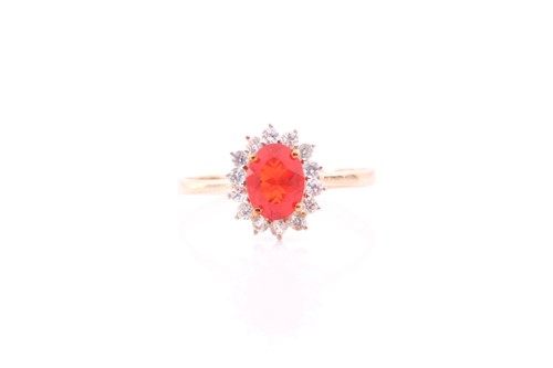 Lot 289 - A 9ct yellow gold, fire opal, and white topaz...