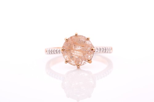 Lot 152 - A 9ct yellow gold and rutilated quartz ring,...