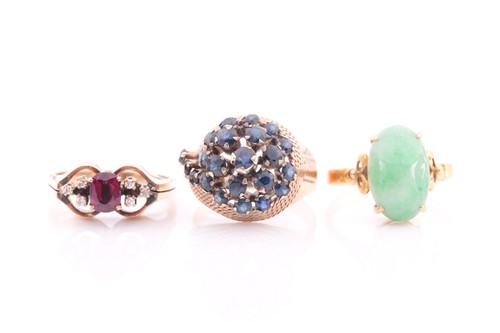 Lot 112 - A yellow metal and ruby ring, the bow-tie...