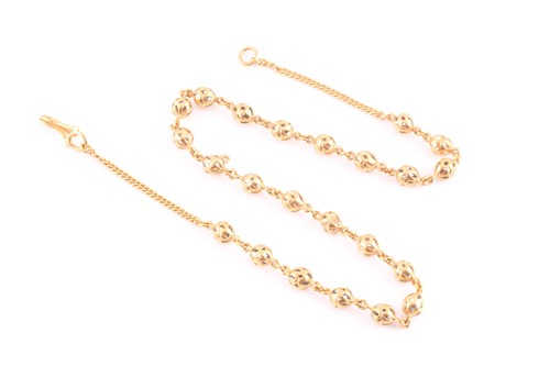 Lot 88 - A yellow metal necklace, comprised of openwork...