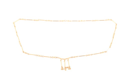Lot 247 - An Indian yellow metal bar and ball-link chain...