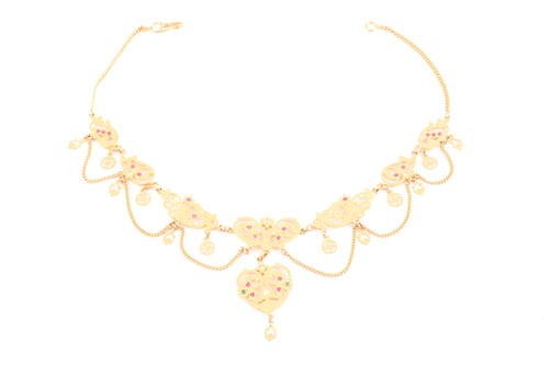 Lot 276 - An Indian yellow metal necklace, the...