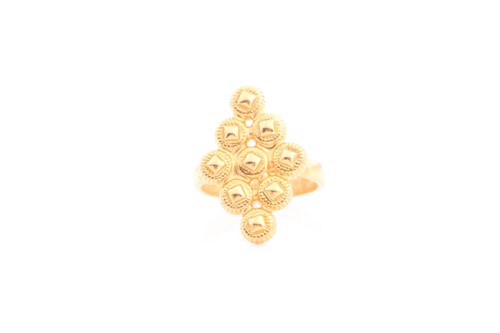 Lot 86 - An Indian yellow metal ring, the...