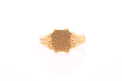 Lot 56 - A yellow metal signet ring, with shield-shaped...