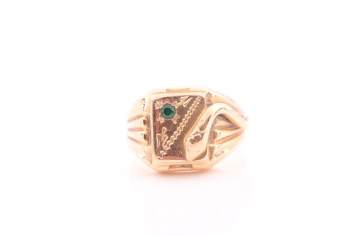 Lot 322 - An unusual yellow metal signet ring, with a...