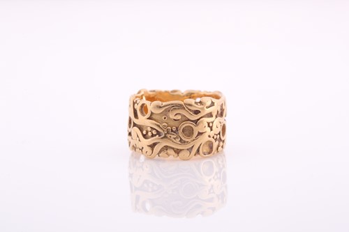 Lot 336 - A plain gold eternity band, with raised...