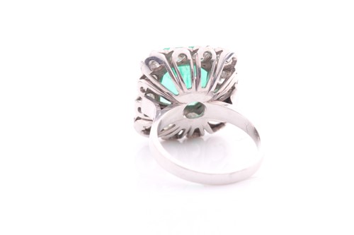 Lot 119 - An emerald and diamond cluster ring; the...