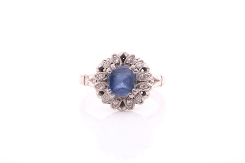 Lot 155 - A pale sapphire and diamond cluster ring, the...