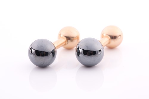 Lot 165 - Tiffany. A pair of barbell style yellow metal...