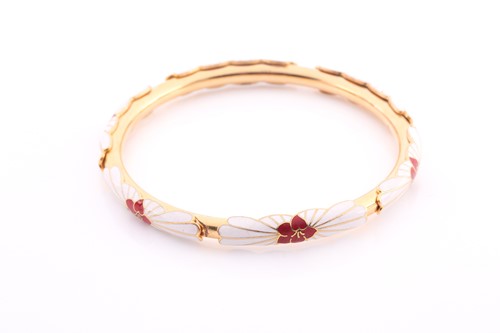Lot 280 - A red and white enamel bangle, the enamelled...