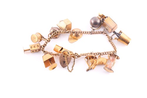 Lot 1 - A charm bracelet; the 9 carat gold curb...