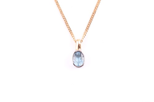 Lot 145 - A single stone blue topaz pendant; the oval...