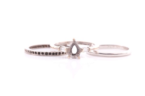 Lot 305 - A wedding band; plain marked 'plat', a white...
