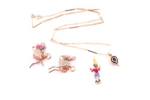 Lot 218 - A pair of novelty floral wheelbarrow clip...