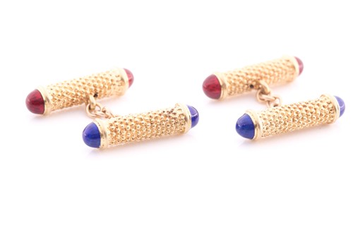 Lot 23 - A pair of yellow metal textured baton...