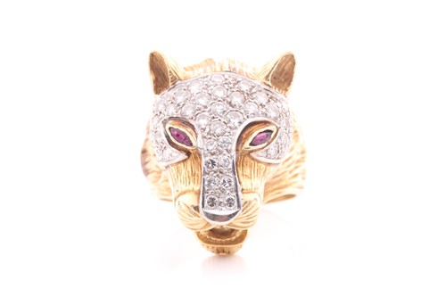Lot 75 - A diamond and ruby set panther mask ring; the...