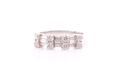 Lot 199 - A diamond half hoop ring; comprising two rows...