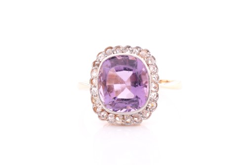 Lot 168 - An amethyst and diamond cluster ring; the...