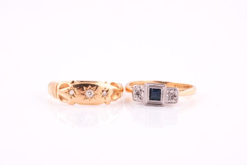 Lot 26 - An Edwardian three stone half hoop sapphire...