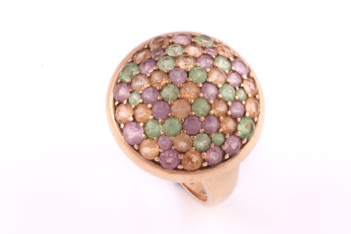 Lot 4 - A multi gem-set dress ring; the domed cluster...