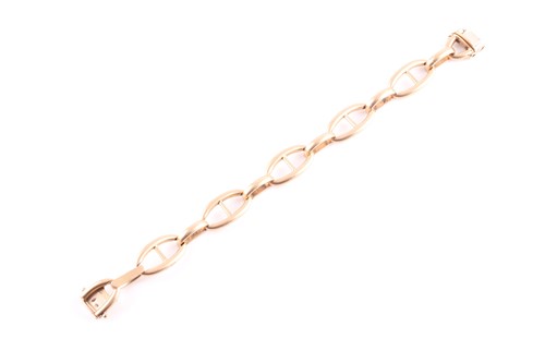 Lot 81 - A French yellow metal Hermes style bracelet;...