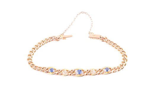 Lot 160 - A 15ct yellow gold, diamond, and sapphire curb-...