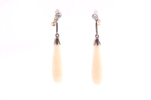 Lot 358 - A pair of white metal, diamond, and opal drop...