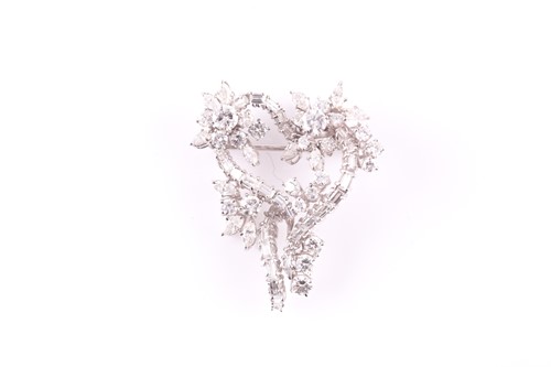 Lot 82 - A white metal and diamond set stylised...