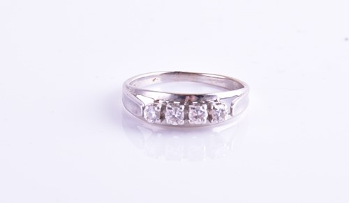 Lot 192 - A white metal and diamond ring, set with four...