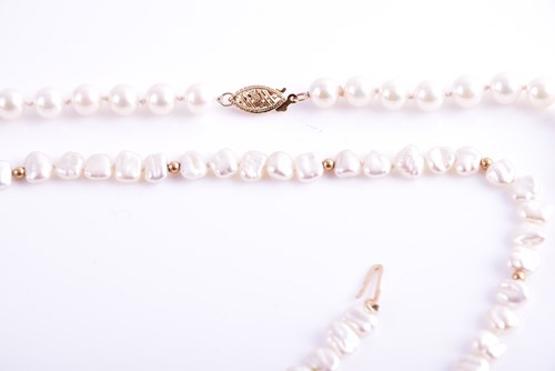 Lot 58 - A cultured pearl necklace with yellow metal...