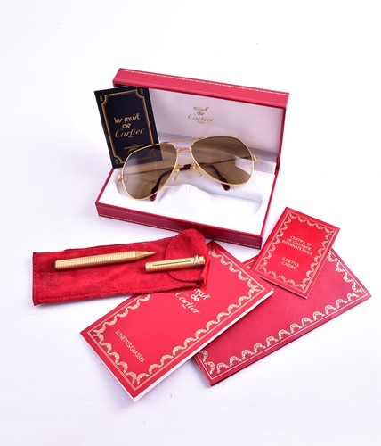 Lot 370 - A Must de Cartier gilt metal pen, in original...
