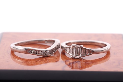 Lot 84 - A platinum and diamond ring, set with an...