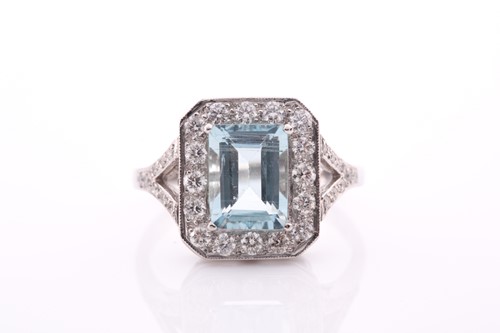 Lot 117 - A platinum, diamond, and aquamarine ring, set...