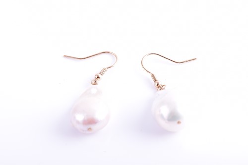 Lot 150 - A pair of yellow metal and Baroque pearl drop...