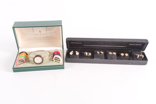 Lot 25 - A Gucci lady's gold plated watch with quartz...