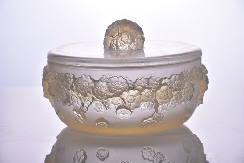 Lot 168 - A Lalique "Primaveres" pattern circular powder...