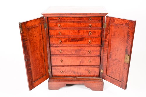 Lot 71 - An unusual George III solid figured satinwood...