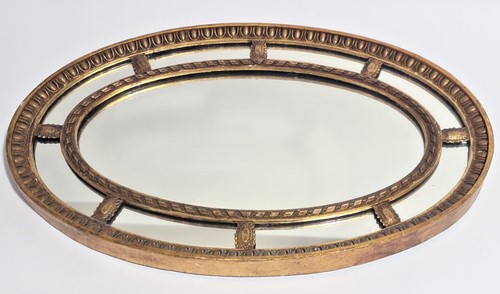 Lot 102 - A George III style oval gilt framed wall...
