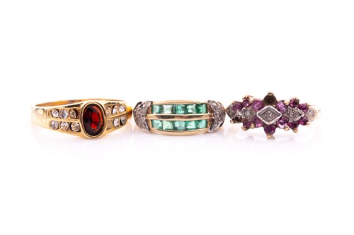 Lot 249 - A 9 carat gold ruby and diamond triple cluster...