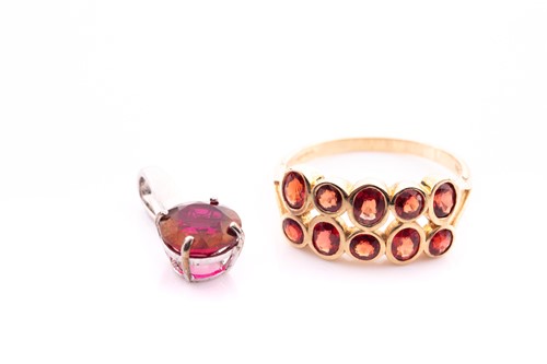 Lot 244 - A 9ct yellow gold and orange sapphire ring,...