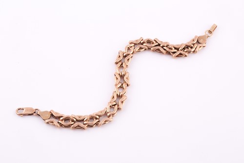 Lot 118 - A 9ct yellow gold fancy-link chain bracelet,...
