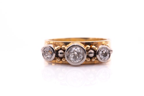Lot 76 - A yellow metal and diamond ring, collet-set in...