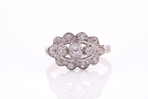 Lot 52 - An 18ct white gold and diamond ring, set with...