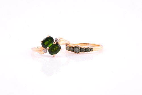 Lot 57 - A two stone chrome diopside cross-over ring...