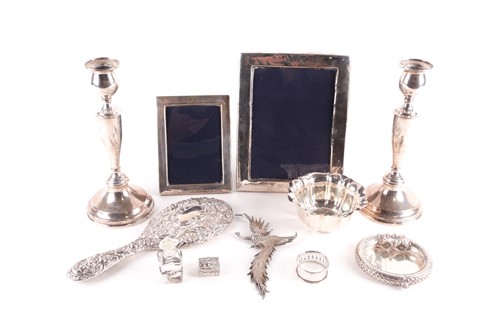 Lot 349 - A pair of silver candle sticks; circular,...
