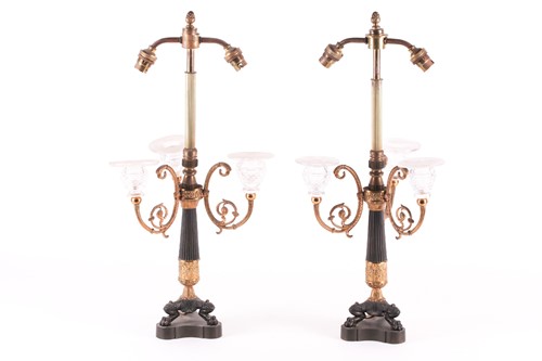 Lot 233 - A pair of French Empire style lamp bases, with...